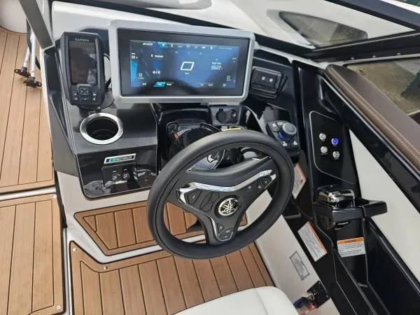 Slide: The Image of 2023 Yamaha Boats 275 SDX dashboard with advanced controls and touchscreen display. - 7