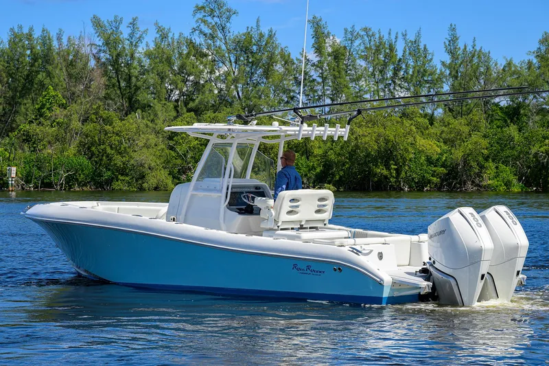 Slide: The Image of 2023 Powerplay Powerboats 30 RumRunner on water, featuring dual engines and sleek design. - 11