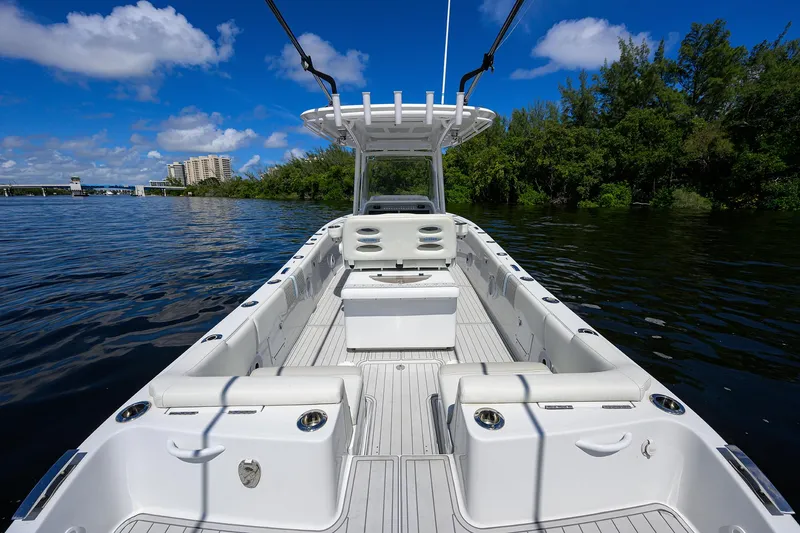 Slide: The Image of 2023 Powerplay Powerboats 30 RumRunner on a sunny day, open deck view. - 33