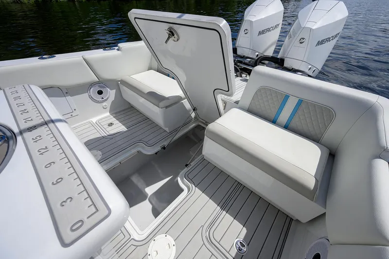 Slide: The Image of 2023 Powerplay Powerboats 30 RumRunner interior with seating and Mercury engines. - 35