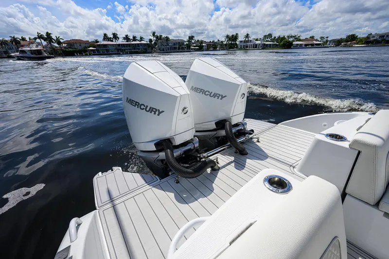 Slide: The Image of 2023 Powerplay Powerboats 30 RumRunner with dual Mercury engines on water. - 37