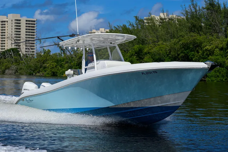 Slide: The Image of 2023 Powerplay Powerboats 30 RumRunner cruising on a sunny day. - 6