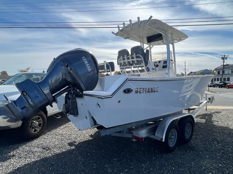 Slide: The Image of 2025 Defiance Catalina 240 boat on trailer with Yamaha outboard motor. - 2