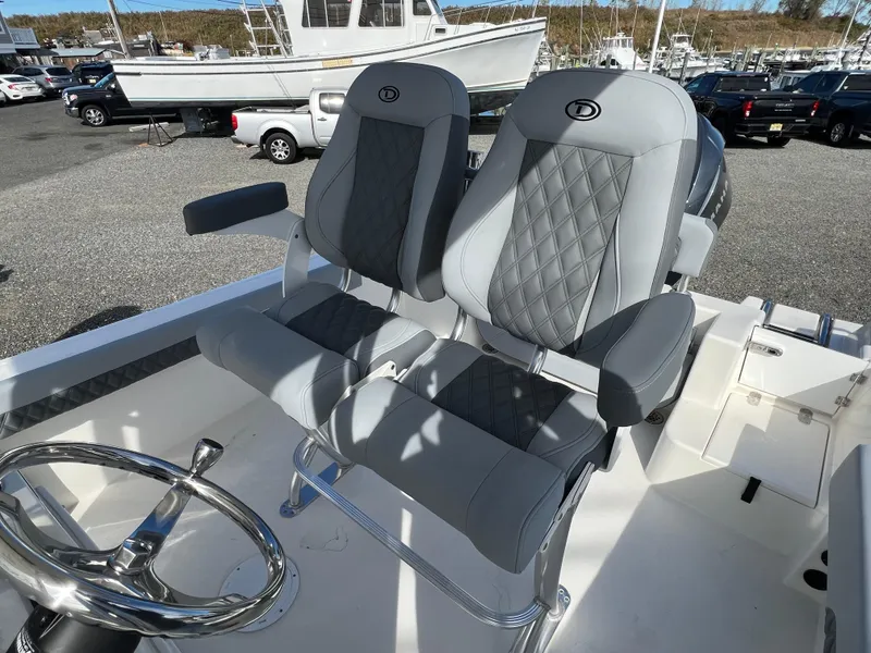 Slide: The Image of Defiance Catalina 240 boat seats, 2025 model, featuring gray diamond-stitched upholstery. - 23