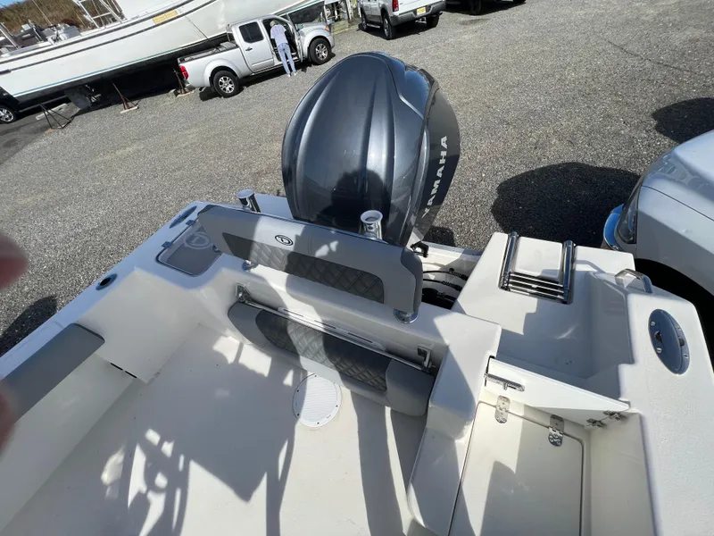 Slide: The Image of 2025 Defiance Catalina 240 boat with Yamaha outboard motor in a parking lot. - 5
