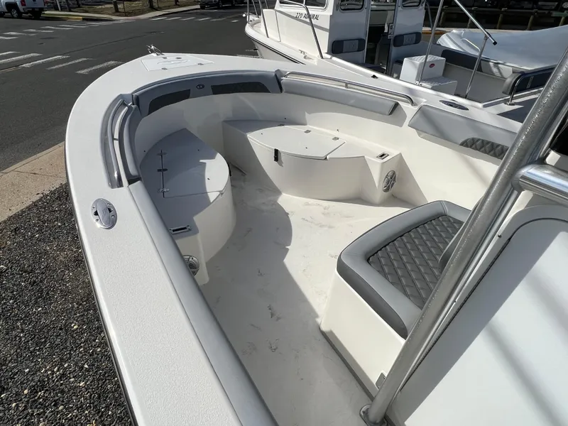 Slide: The Image of 2025 Defiance Catalina 240 boat interior with seating and storage compartments. - 17