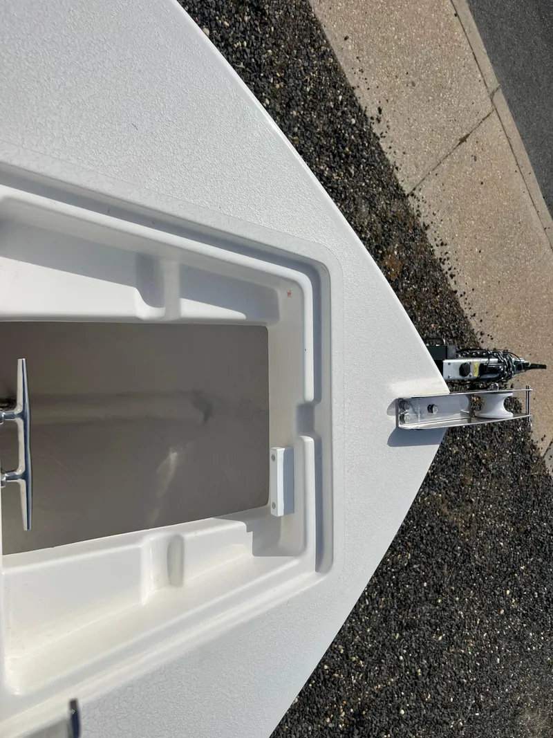 Slide: The Image of 2025 Defiance Catalina 240 boat deck with open storage compartment. - 21