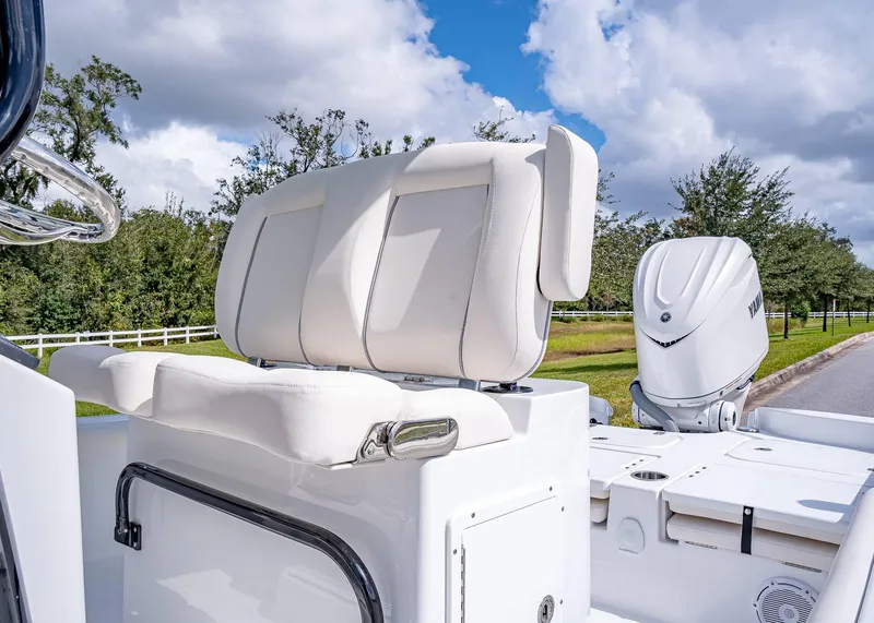 Slide: The Image of 2025 Sea Hunt BX 25 FS boat with white seating and Yamaha outboard motor. - 13