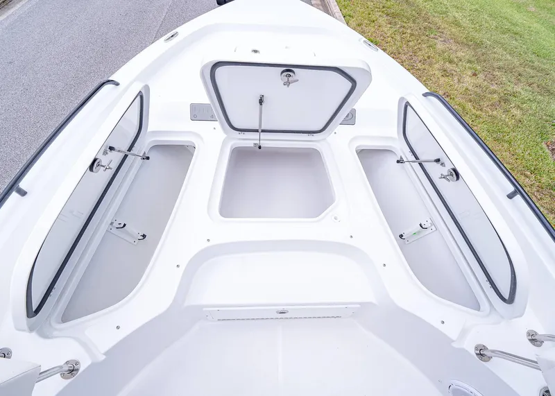 Slide: The Image of 2025 Sea Hunt BX 25 FS boat storage compartments open, showcasing spacious design. - 21