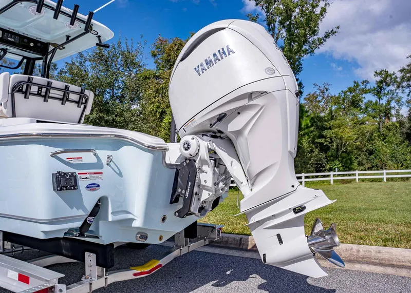 Slide: The Image of 2025 Sea Hunt BX 25 FS boat with Yamaha outboard motor on trailer. - 6