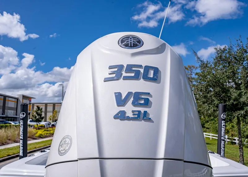 Slide: The Image of 2025 Sea Hunt BX 25 FS boat engine, 350 V6 4.3L, under blue sky. - 7