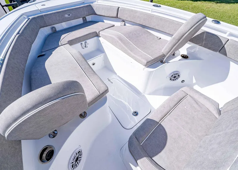 Slide: The Image of 2025 Sea Hunt Ultra 255 SE boat interior with gray cushioned seating. - 20