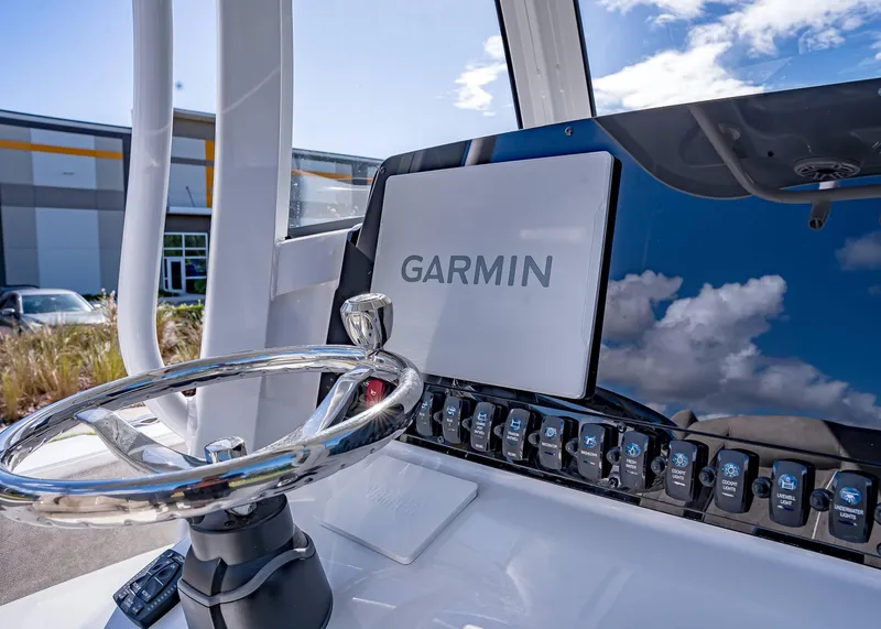 Slide: The Image of 2025 Sea Hunt Ultra 255 SE boat dashboard with Garmin navigation system. - 24