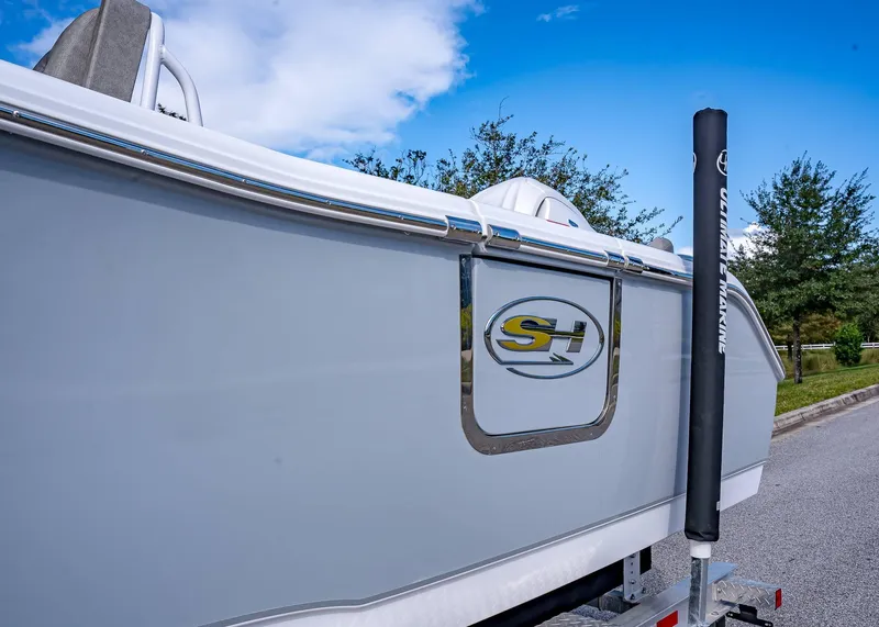 Slide: The Image of 2025 Sea Hunt Ultra 255 SE boat on trailer, side view with logo. - 5