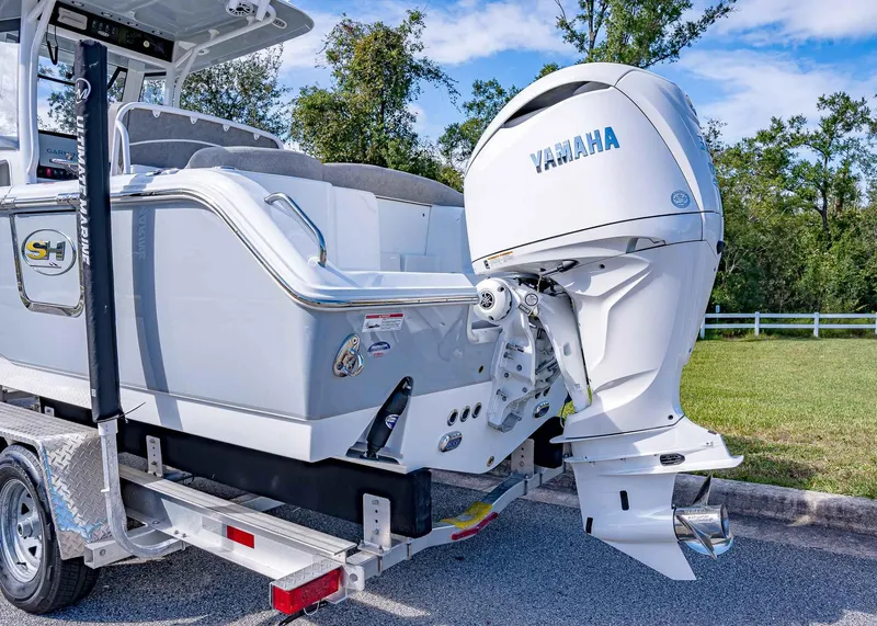 Slide: The Image of 2025 Sea Hunt Ultra 255 SE boat with Yamaha outboard engine on a trailer. - 7