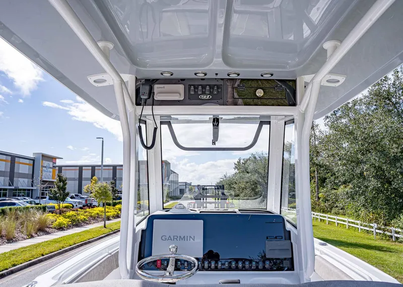 Slide: The Image of 2025 Sea Hunt Ultra 255 SE boat dashboard with Garmin navigation system. - 8