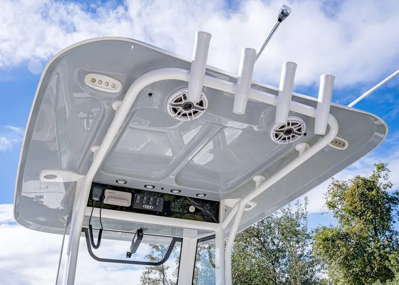 Slide: The Image of 2025 Sea Hunt Ultra 255 SE boat console with speakers and rod holders. - 9