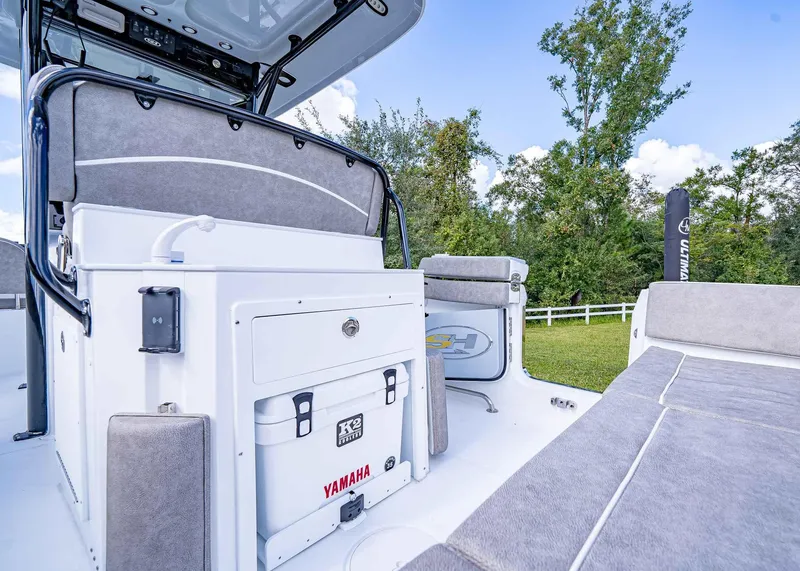 Slide: The Image of 2025 Sea Hunt Ultra 255 SE boat interior with Yamaha cooler and seating. - 16