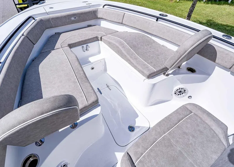 Slide: The Image of 2025 Sea Hunt Ultra 255 SE boat interior with gray cushioned seating. - 20