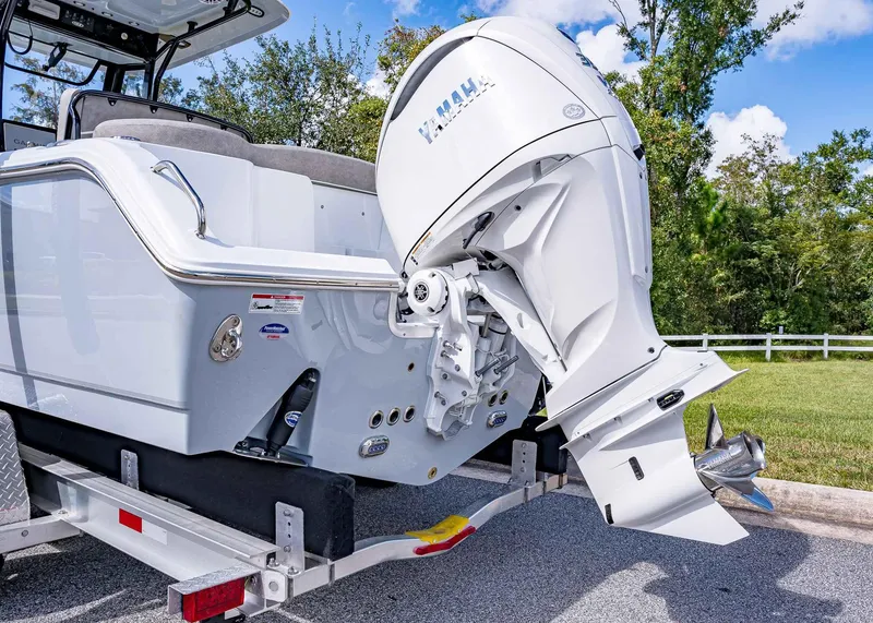 Slide: The Image of 2025 Sea Hunt Ultra 255 SE boat with Yamaha outboard engine on trailer. - 4