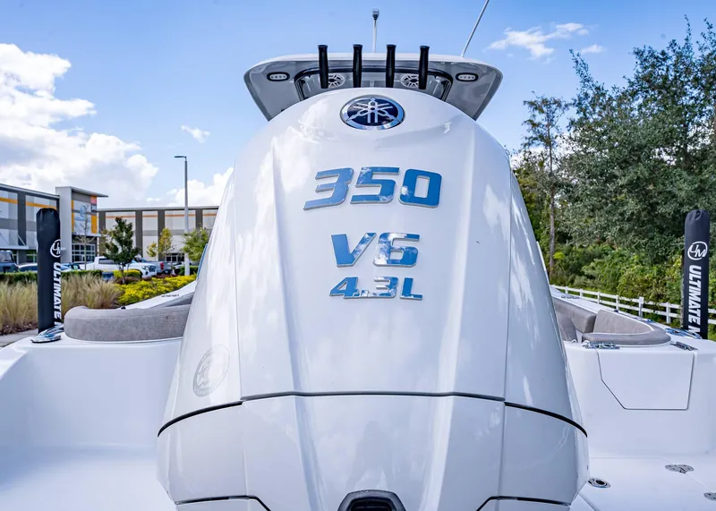 Slide: The Image of 2025 Sea Hunt Ultra 255 SE boat with 350 V6 engine, outdoor setting. - 5