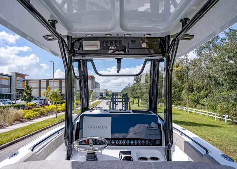 Slide: The Image of 2025 Sea Hunt Ultra 255 SE boat interior with Garmin navigation system. - 6