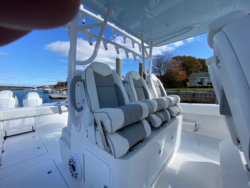 Slide: The Image of 2023 Invincible 46 Catamaran Plus Quad Axle Trailer with luxurious seating on deck. - 18