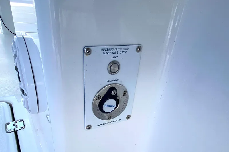 Slide: The Image of 2023 Invincible 46 Catamaran flushing system control panel on white surface. - 20