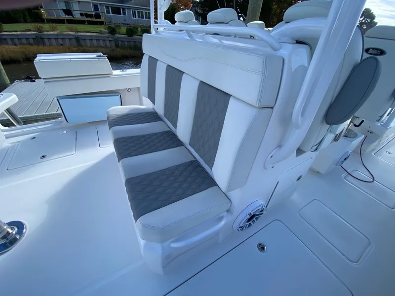 Slide: The Image of 2023 Invincible 46 Catamaran Plus Quad Axle Trailer, featuring stylish seating. - 21