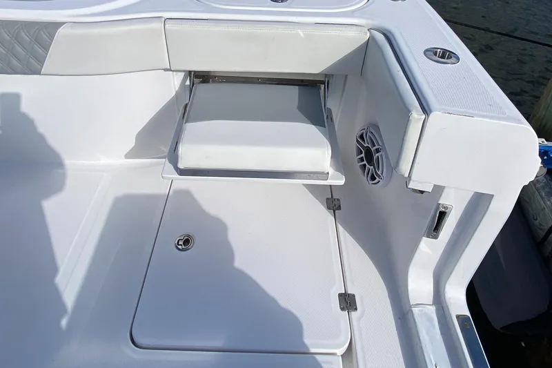 Slide: The Image of 2023 Invincible 46 Catamaran Plus Quad Axle Trailer, featuring sleek white deck design. - 26