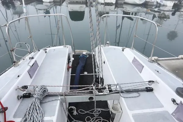 Slide: The Image of 1985 Soverel 33 sailboat deck with ropes and marina view. - 10