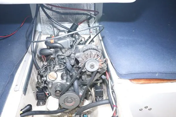 Slide: The Image of Engine compartment of a 1985 Soverel 33 sailboat, showcasing mechanical components. - 19