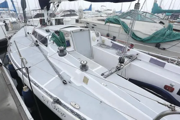 Slide: The Image of 1985 Soverel 33 sailboat docked in marina, surrounded by other boats. - 20