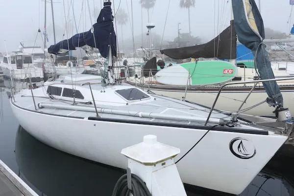Slide: The Image of 1985 Soverel 33 sailboat docked in a foggy marina. - 22