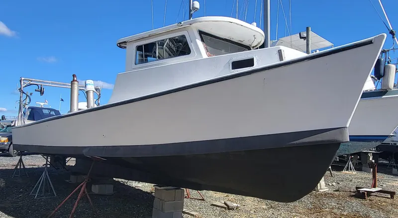 Slide: The Image of 1985 Kinnamon Pilot House Chesapeake Deadrise boat on dry dock, side view. - 26