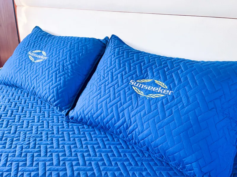 Slide: The Image of Blue Sunseeker-branded bedding on a 2005 Predator 68 yacht. - 12