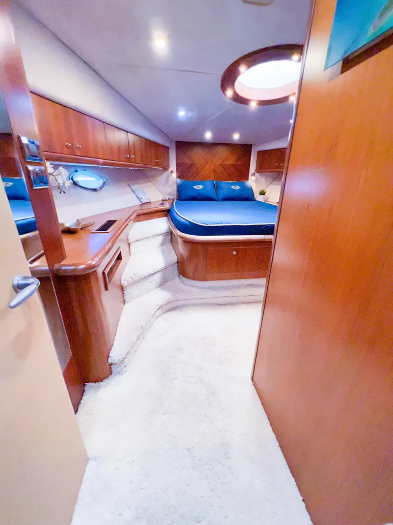 Slide: The Image of Luxurious cabin interior of 2005 Sunseeker Predator 68 yacht with blue bedding. - 16