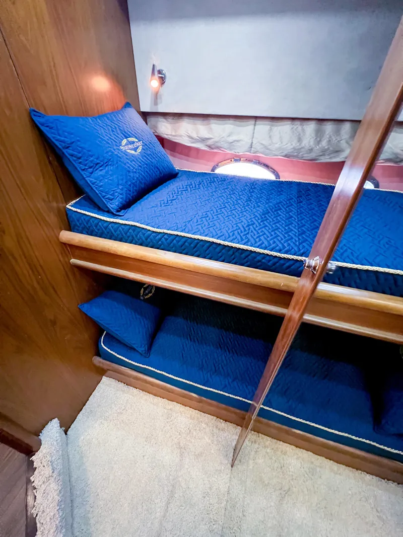 Slide: The Image of Sunseeker Predator 68 yacht cabin with blue bunk beds, 2005 model. - 22