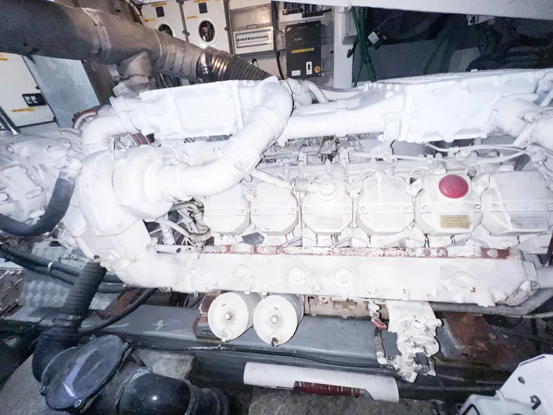 Slide: The Image of Engine room of 2005 Sunseeker Predator 68 yacht, showcasing detailed machinery components. - 26