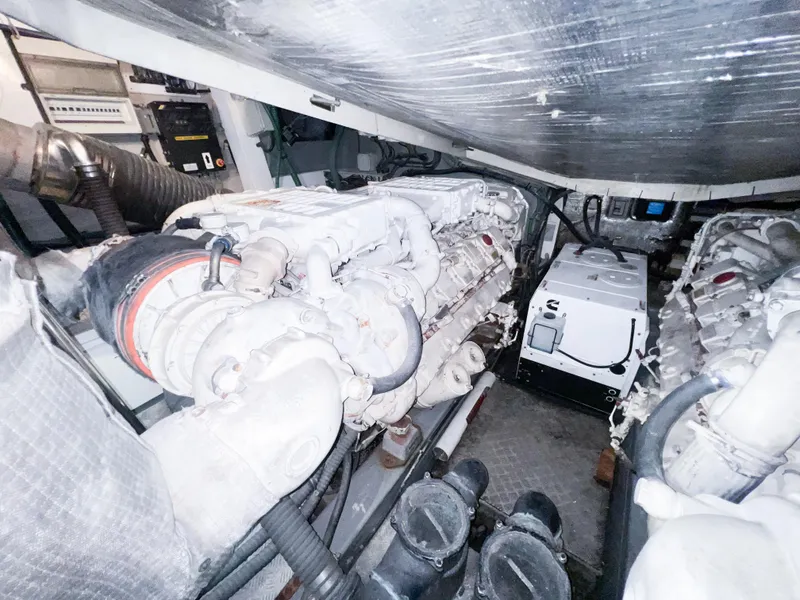 Slide: The Image of Engine room of 2005 Sunseeker Predator 68 yacht, showcasing powerful machinery and components. - 27