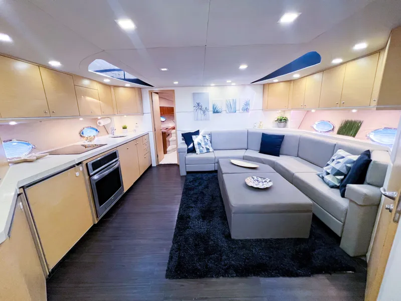 Slide: The Image of Luxurious interior of 2005 Sunseeker Predator 68 yacht with modern kitchen and spacious seating area. - 3