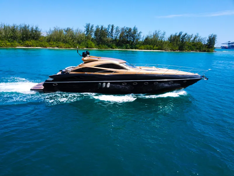 Slide: The Image of 2005 Sunseeker Predator 68 yacht cruising on blue water. - 32