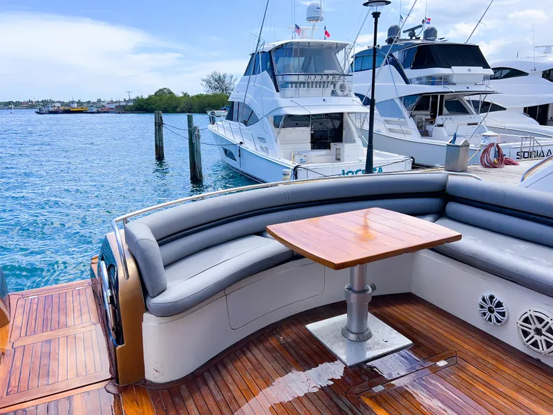 Slide: The Image of Sunseeker Predator 68 yacht deck with seating and table, docked by the water, 2005 model. - 33