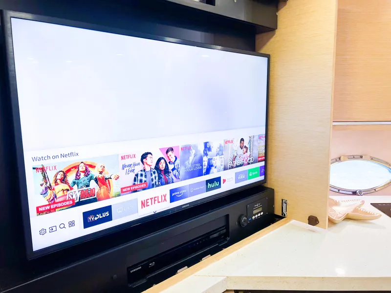 Slide: The Image of Entertainment system on 2005 Sunseeker Predator 68 yacht with streaming services displayed. - 7