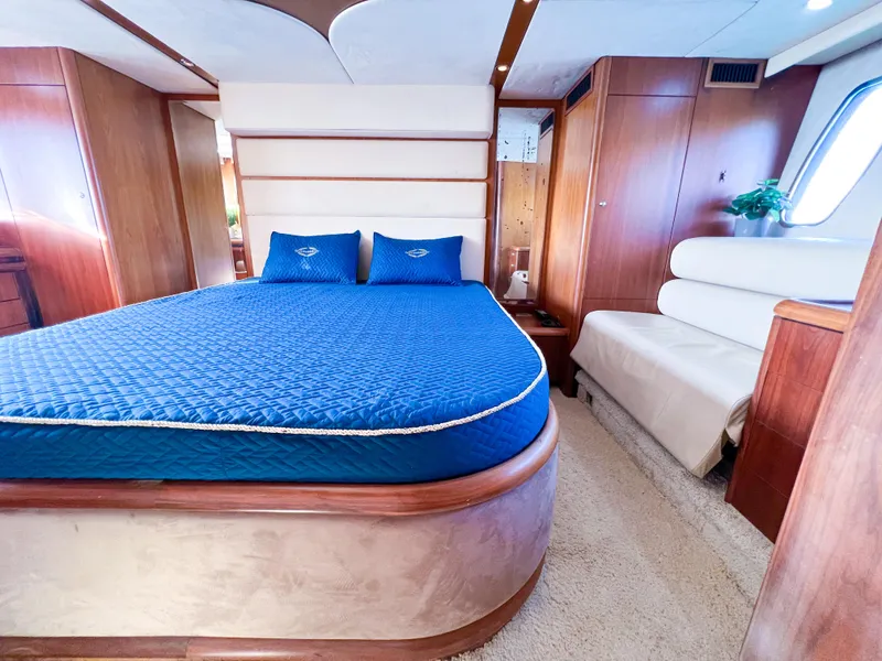 Slide: The Image of Luxurious bedroom interior of 2005 Sunseeker Predator 68 yacht with blue bedding. - 9