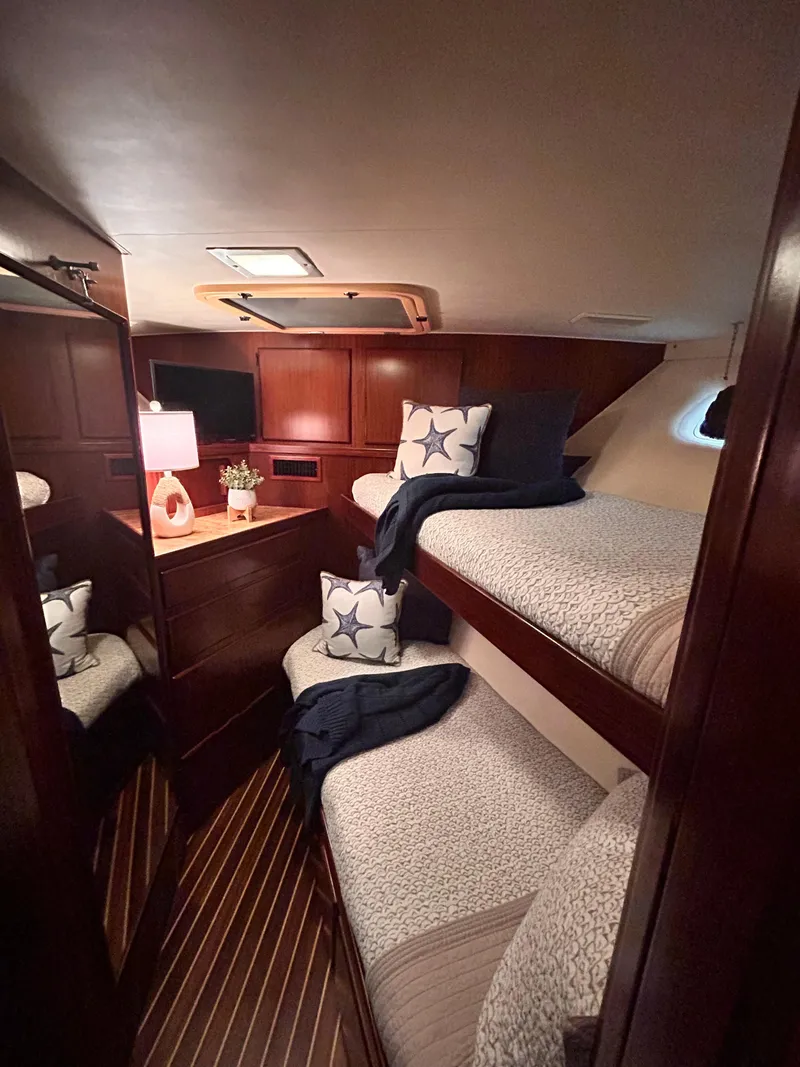 Slide: The Image of Cozy cabin with bunk beds in 1989 Hatteras 67 Cockpit Motor Yacht. - 14