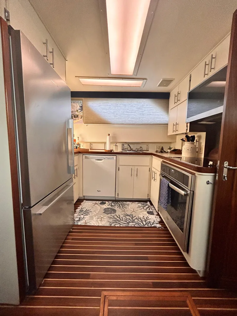Slide: The Image of Interior kitchen of 1989 Hatteras 67 Cockpit Motor Yacht with modern appliances. - 15