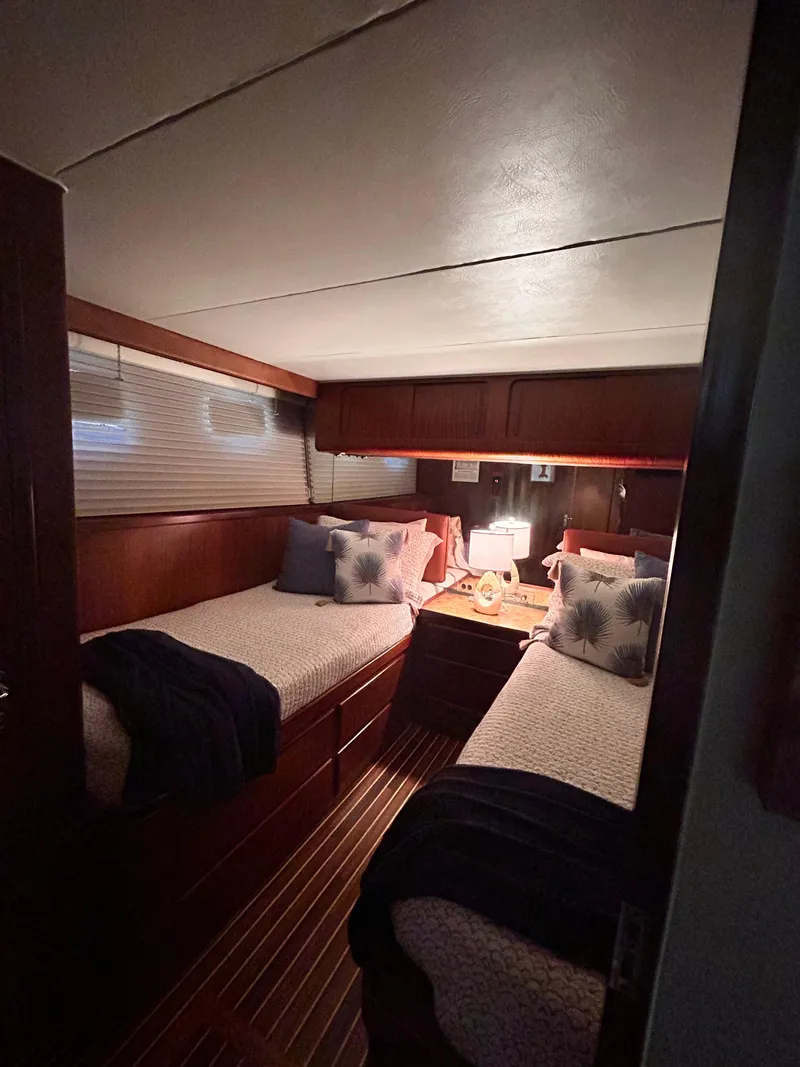 Slide: The Image of Cozy twin cabin in 1989 Hatteras 67 Cockpit Motor Yacht with elegant wood finish. - 17