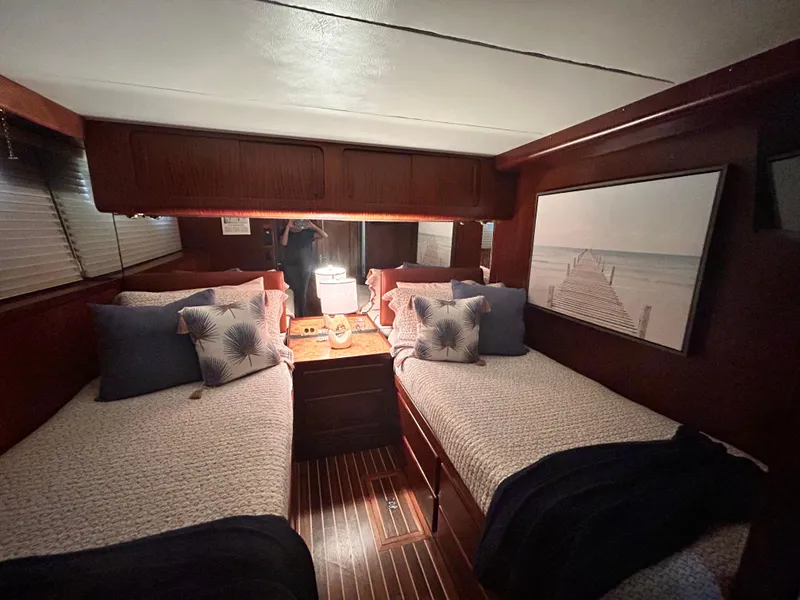 Slide: The Image of Interior cabin of 1989 Hatteras 67 Cockpit Motor Yacht with twin beds and nautical decor. - 18