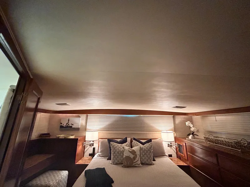 Slide: The Image of Luxurious bedroom interior of 1989 Hatteras 67 Cockpit Motor Yacht. - 19
